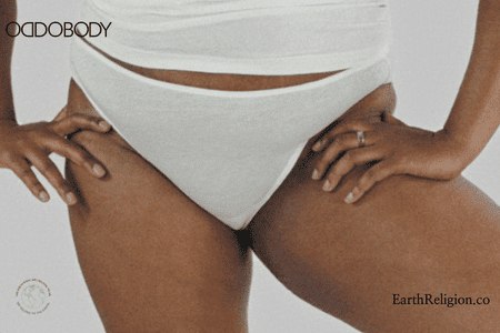 Woman with hands on hips dressed in sustainable underwear and shirt from the brand Oddobody